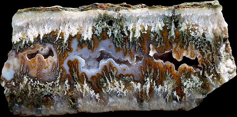 This Agate is white, transparent, green, and brown.