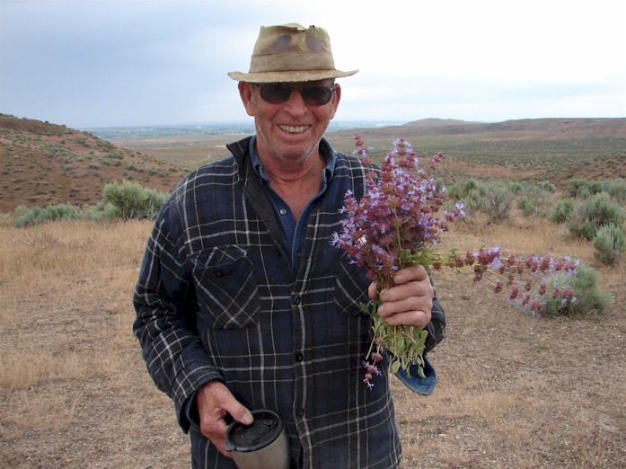 Jake holding some flowers and coffee