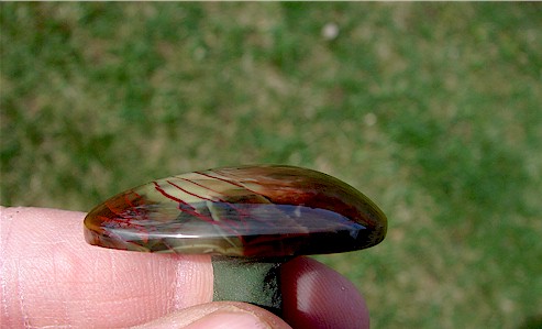 Morrisonite Cab Prize-teardrop shape with brown, red, and cream.